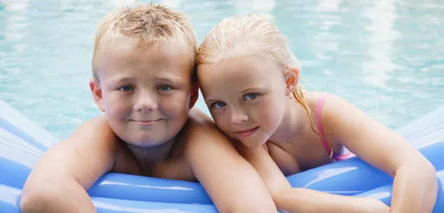 Young siblings bathing together