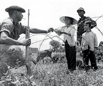  Kiwi soldier with Vietnamese children, 1969. 