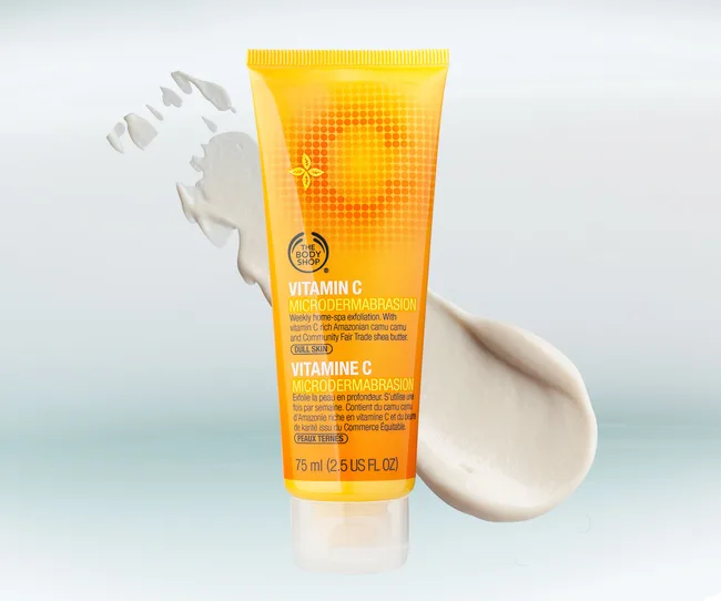 Vitamin C Microdermabrasion tube by The Body Shop with cream texture displayed.
