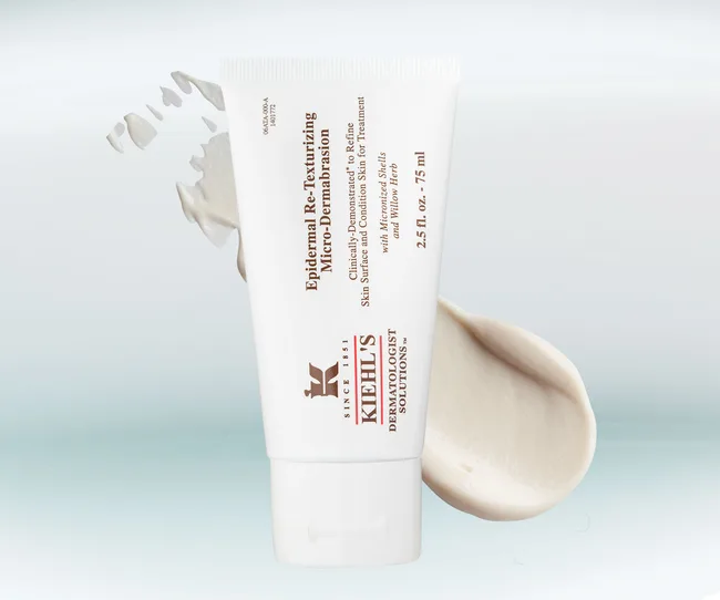 Kiehl's Epidermal Re-Texturizing Micro-Dermabrasion tube with cream smear on a light background.