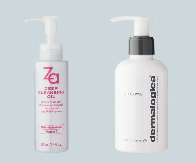Bottles of Za Deep Cleansing Oil and Dermalogica Precleanse with pump tops on a light blue background.