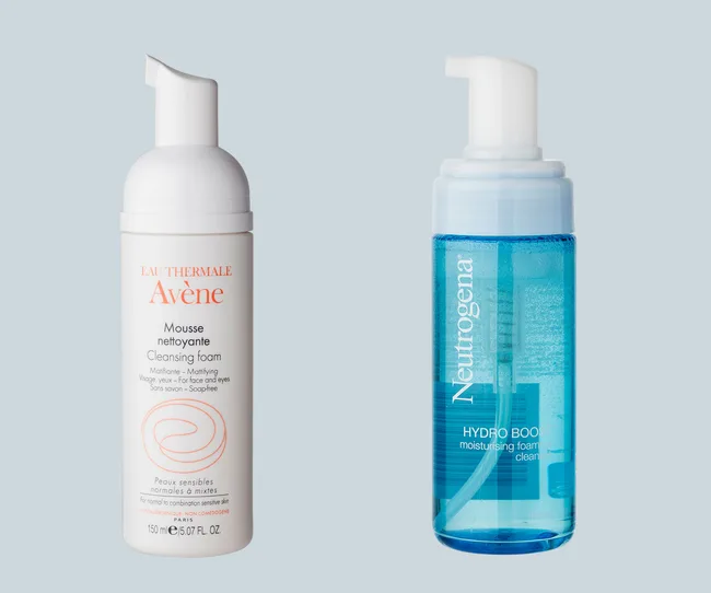 Avène Cleansing Foam and Neutrogena Hydro Boost Moisturizing Foam Cleanser side by side on a light blue background.