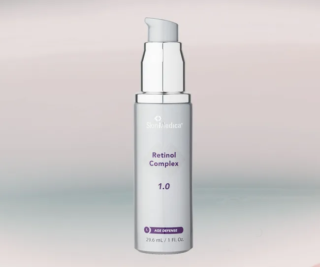 SkinMedica Retinol Complex 1.0 bottle, silver with a pump, 29.6 mL, labeled Age Defense.