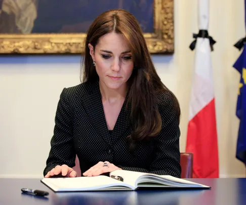 Catherine, Duchess of Cambridge, signs book of condolences for victims of Paris terror attacks