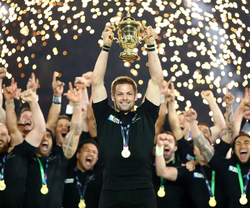 Richie McCaw holds up the Rugby World Cup trophy