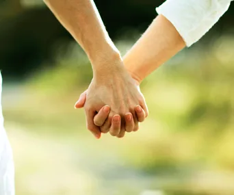 Couple holding hands