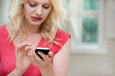 Woman sending a text message