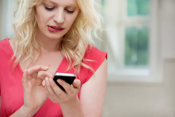 Woman sending a text message