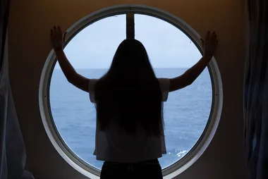 Woman staring at the ocean