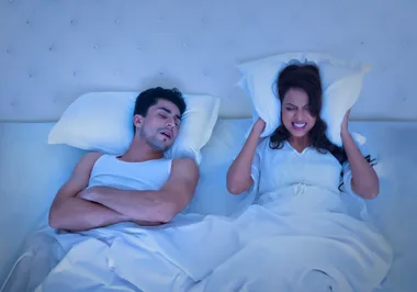 woman putting up with husband's snoring