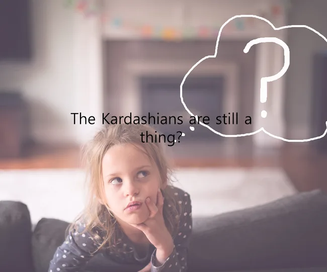 Girl pondering on couch with text: "The Kardashians are still a thing?" in a thought bubble.
