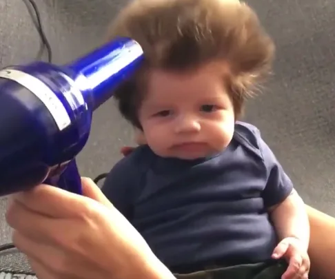 8-week old baby has an incredible amount of hair