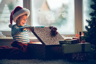 Boy opening Christmas gift