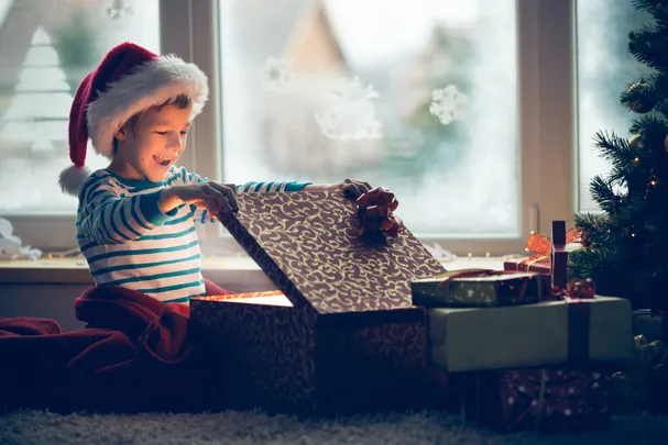 Boy opening Christmas gift