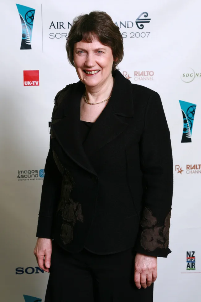 Woman in a black jacket smiling at the Air New Zealand Screen Awards 2007 backdrop.