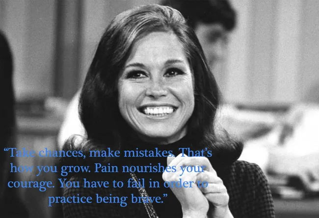 A woman smiling with a quote about courage overlayed. Black and white photography.