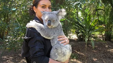 Kim Kardashian cuddles a Koala, snaps a selfie