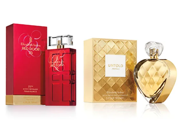 Red and gold Elizabeth Arden perfume bottles and boxes.