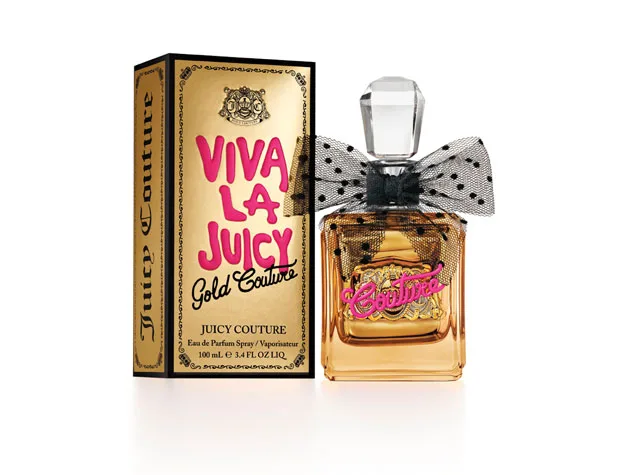 "Viva La Juicy Gold Couture perfume bottle with black polka dot bow, next to its gold and pink packaging."