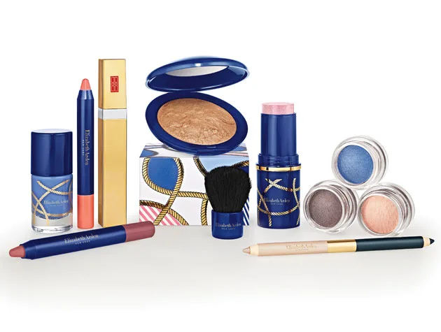 Elizabeth Arden makeup products including lipsticks, nail polish, eyeshadows, and face powders in blue packaging.