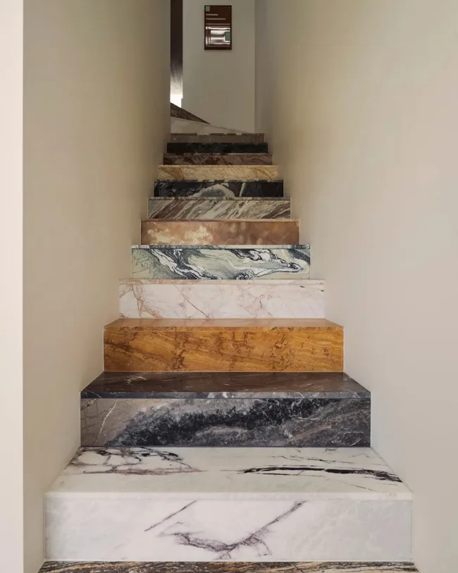Fourteen different types of stone comprise the stairway.