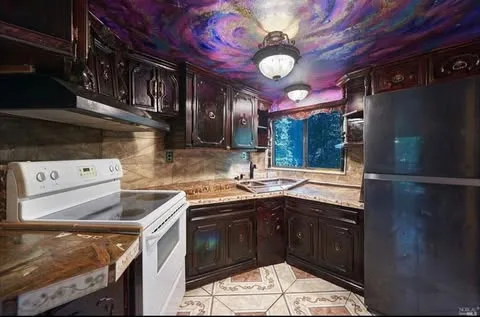 A kitchen with a galaxy design on the roof