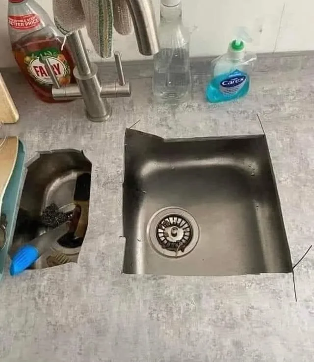 A sink with a very badly cut benchtop