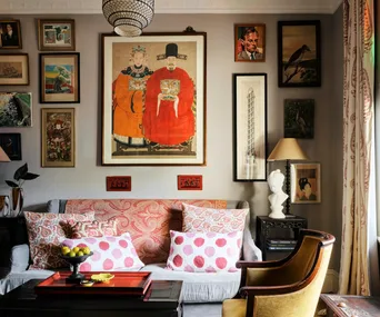 A sitting room with a gallery wall and original heritage details