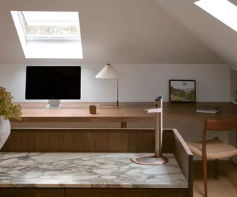 A stylish home office with a timber desktop, iMac and ZipTap