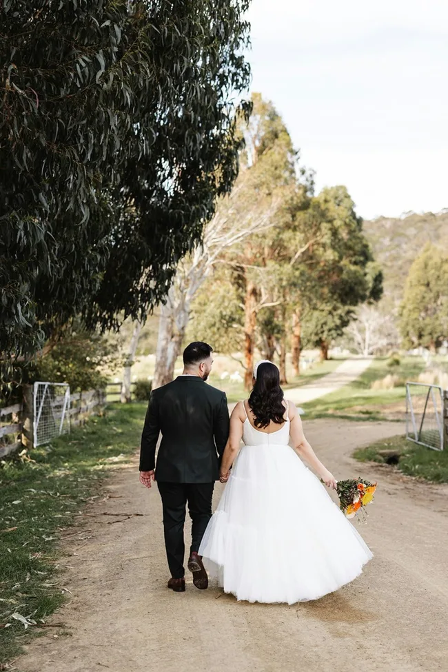 A couple walking on Bangor Vineyard Shed's estate