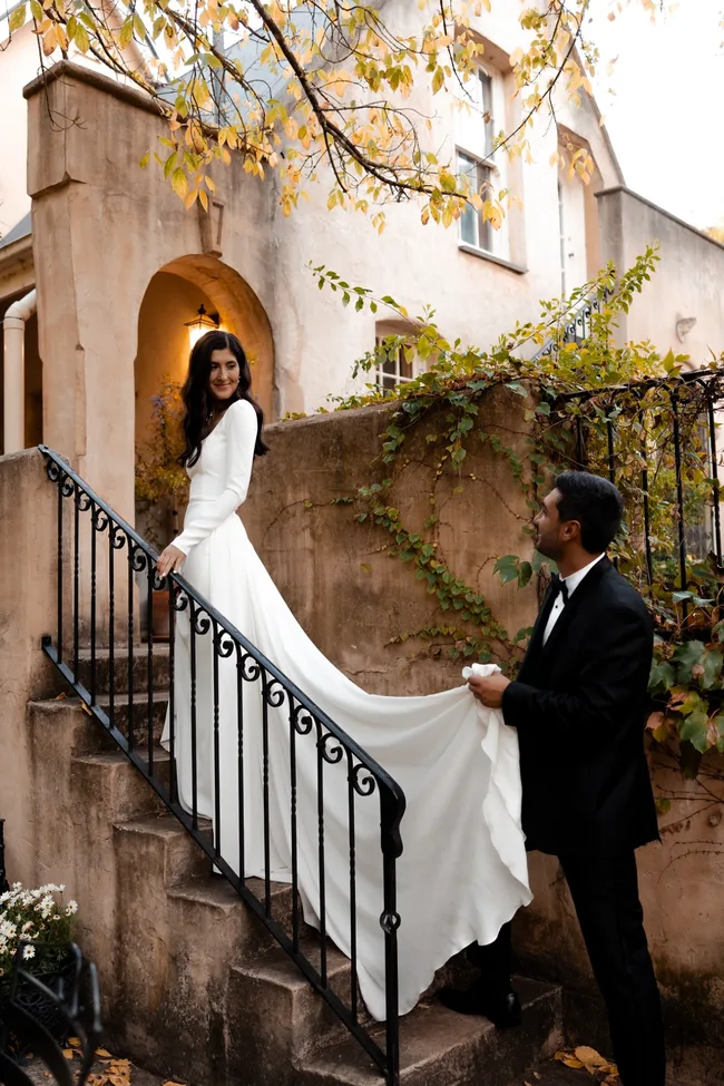 A bride and groom outside of Maison de Moon