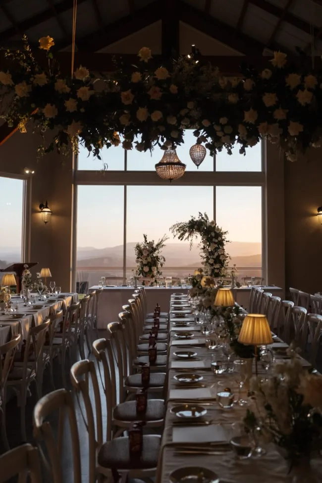 Inside a reception area overlooking mountains at The Old Dairy Maleny