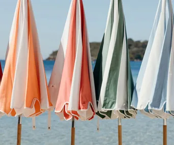 Basil bangs colourful beach umbrellas