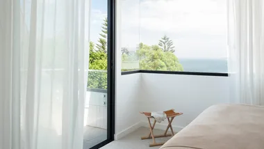 breezy bedroom with ocean views