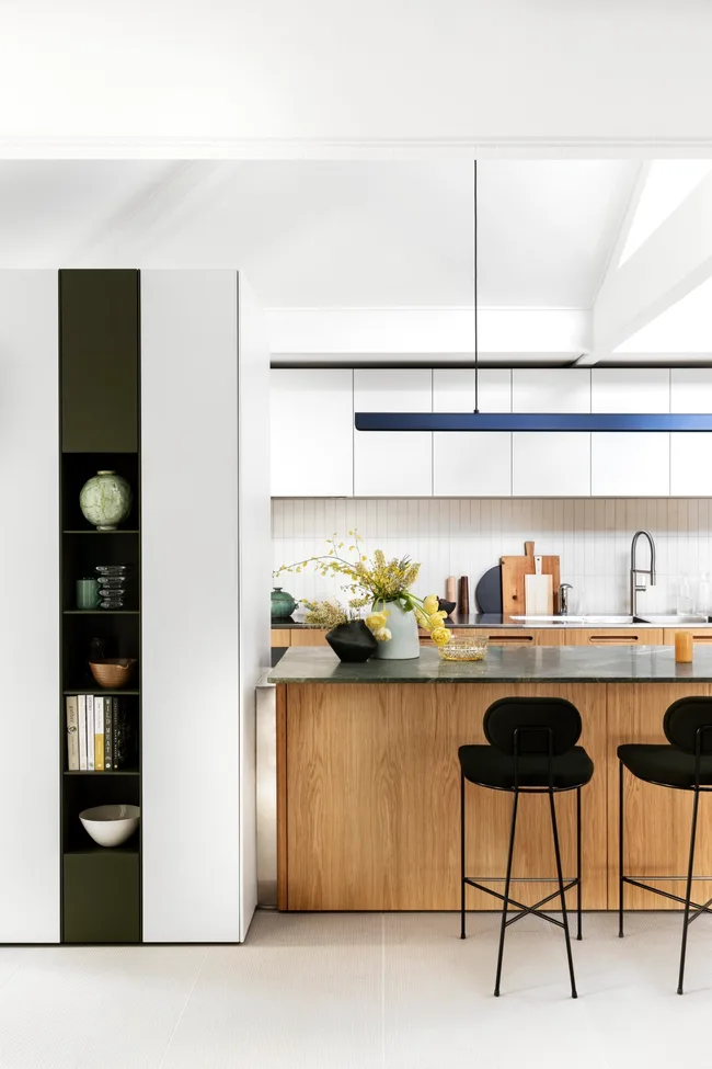 A bright and modern kitchen with green accents