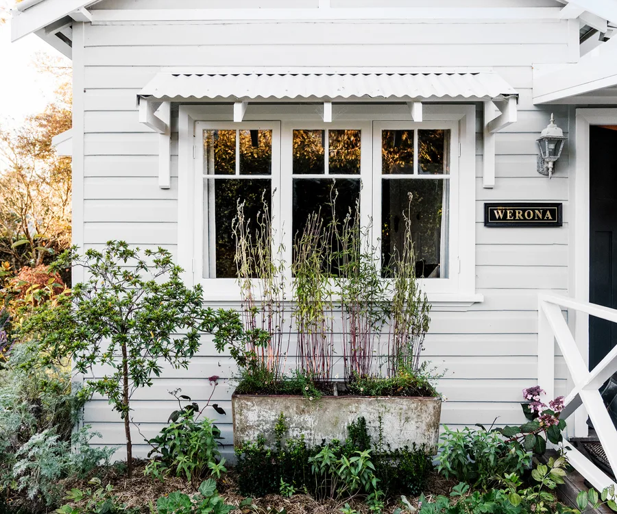 white weatherboard cottage facade exterior