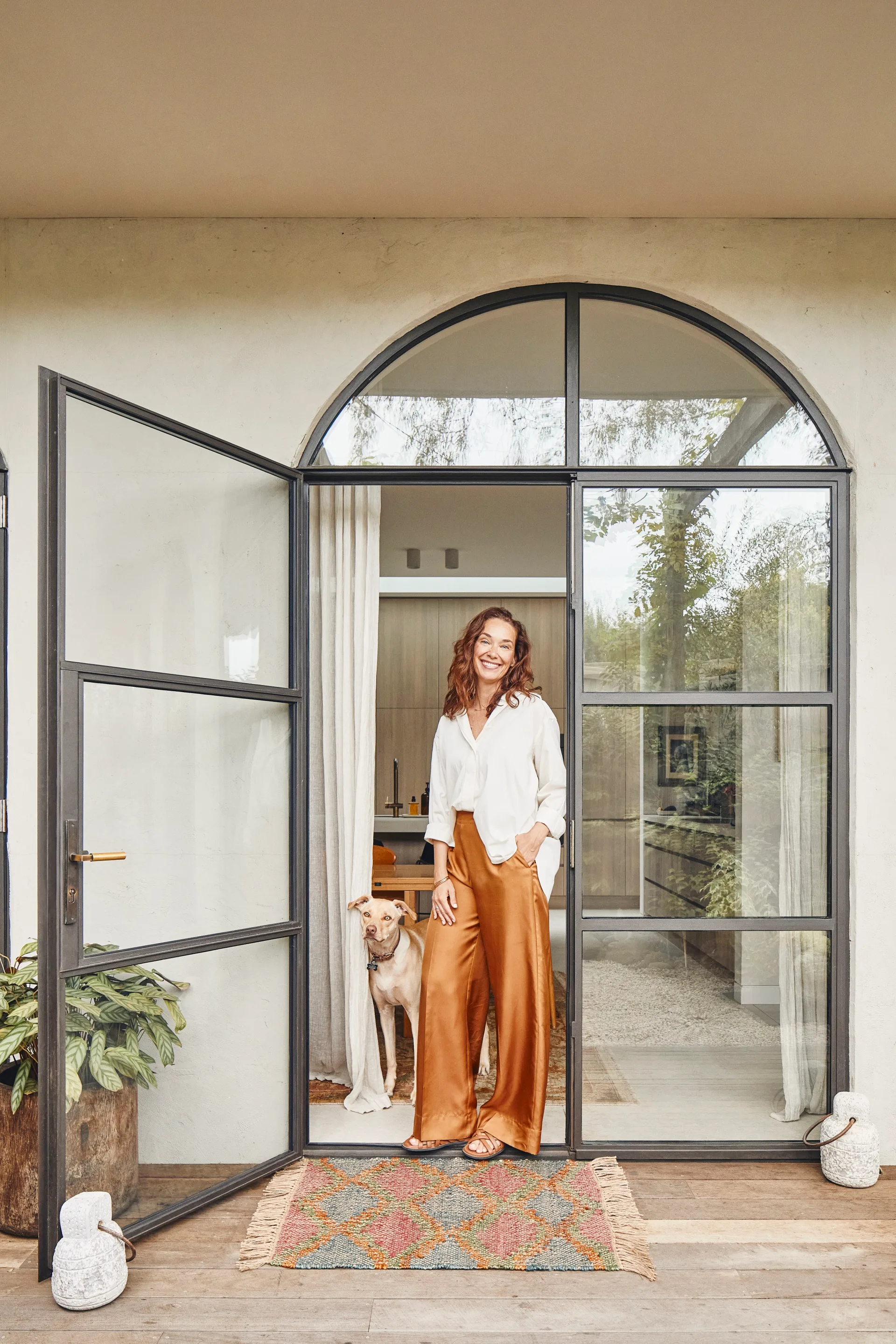 st-kilda-stefanie-home-owner-with-dog-front-door