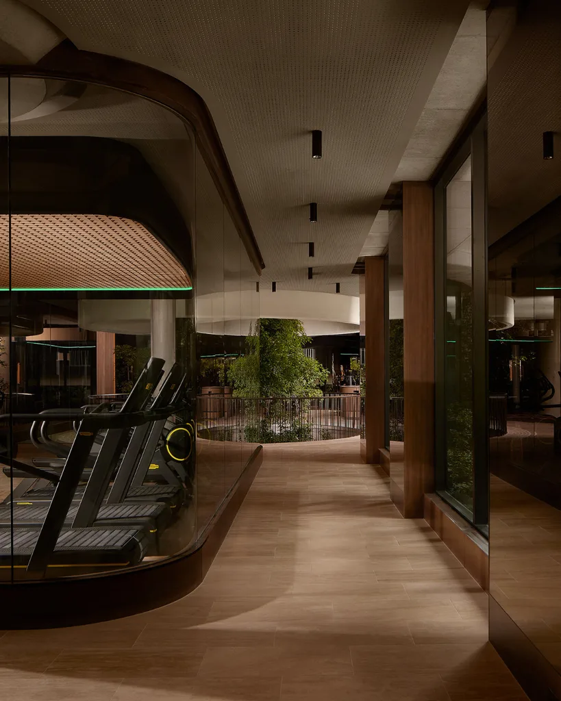 A moody gym with wooden flooring