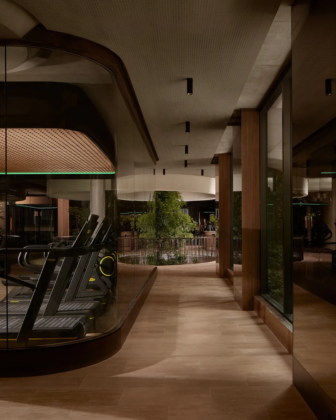 A moody gym with wooden flooring