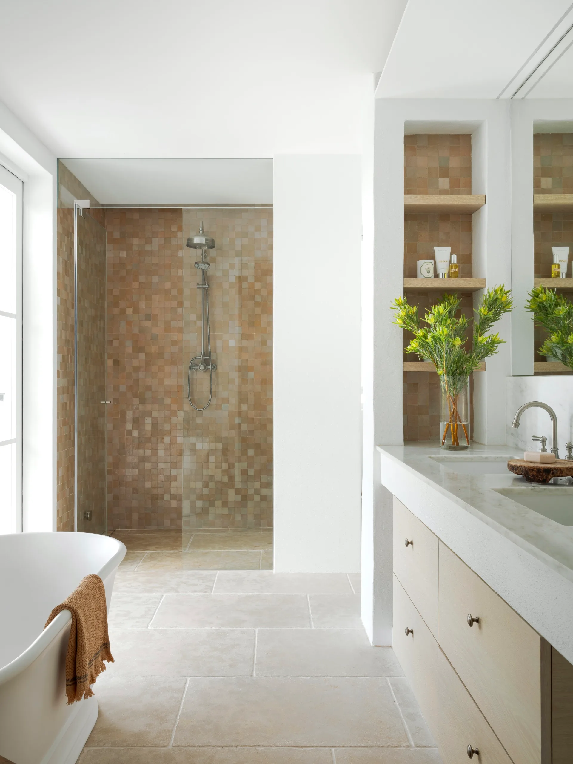 cape dutch home's bathroom with warm neutral tiles