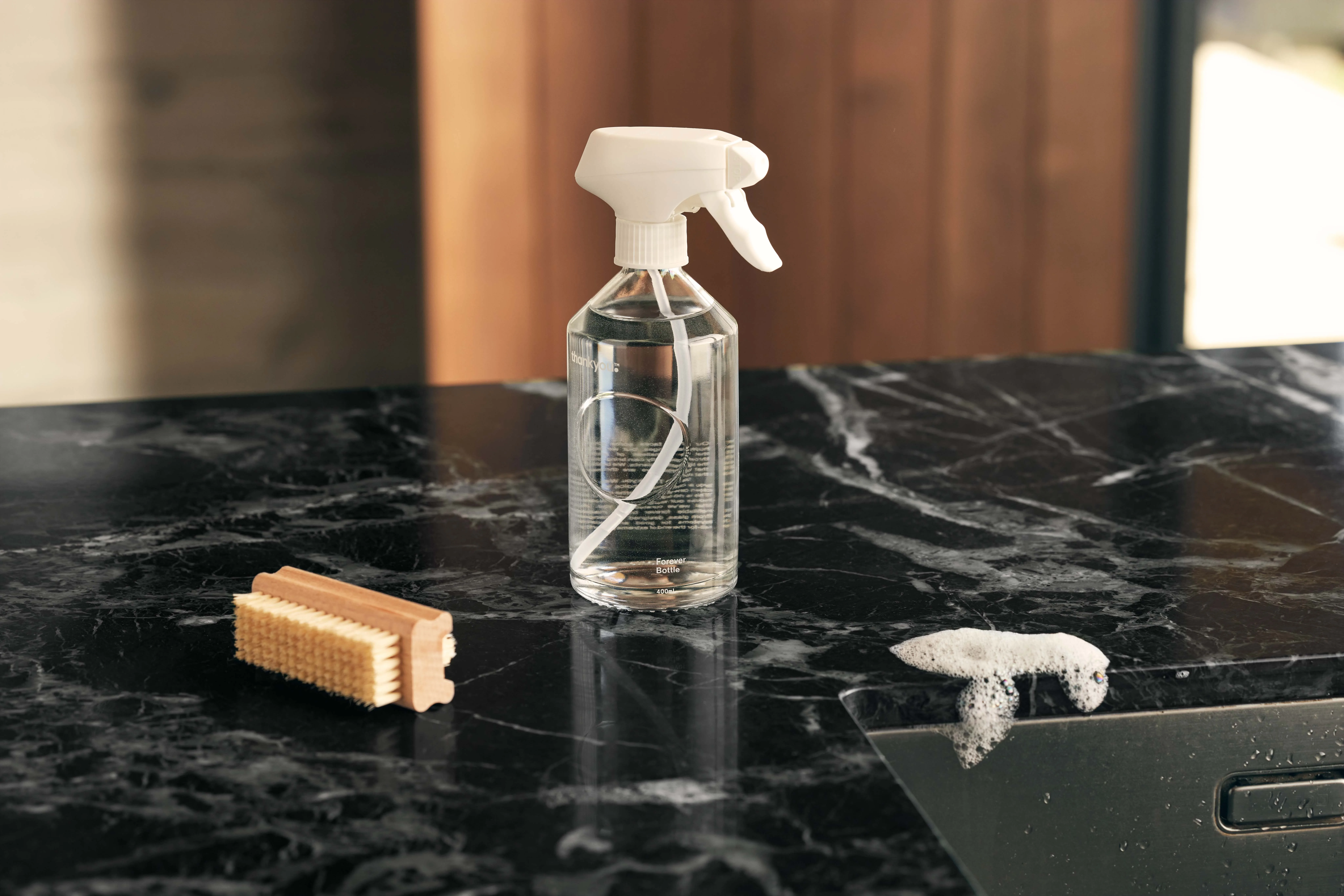 a clear glass spray bottle