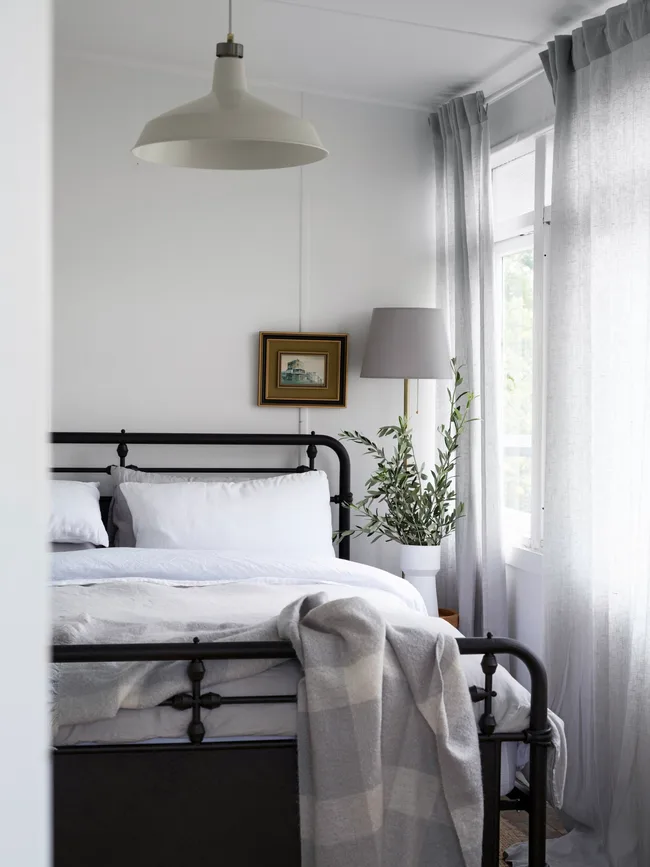 A country bedroom at boutique accommodation Milk Haus in Milton