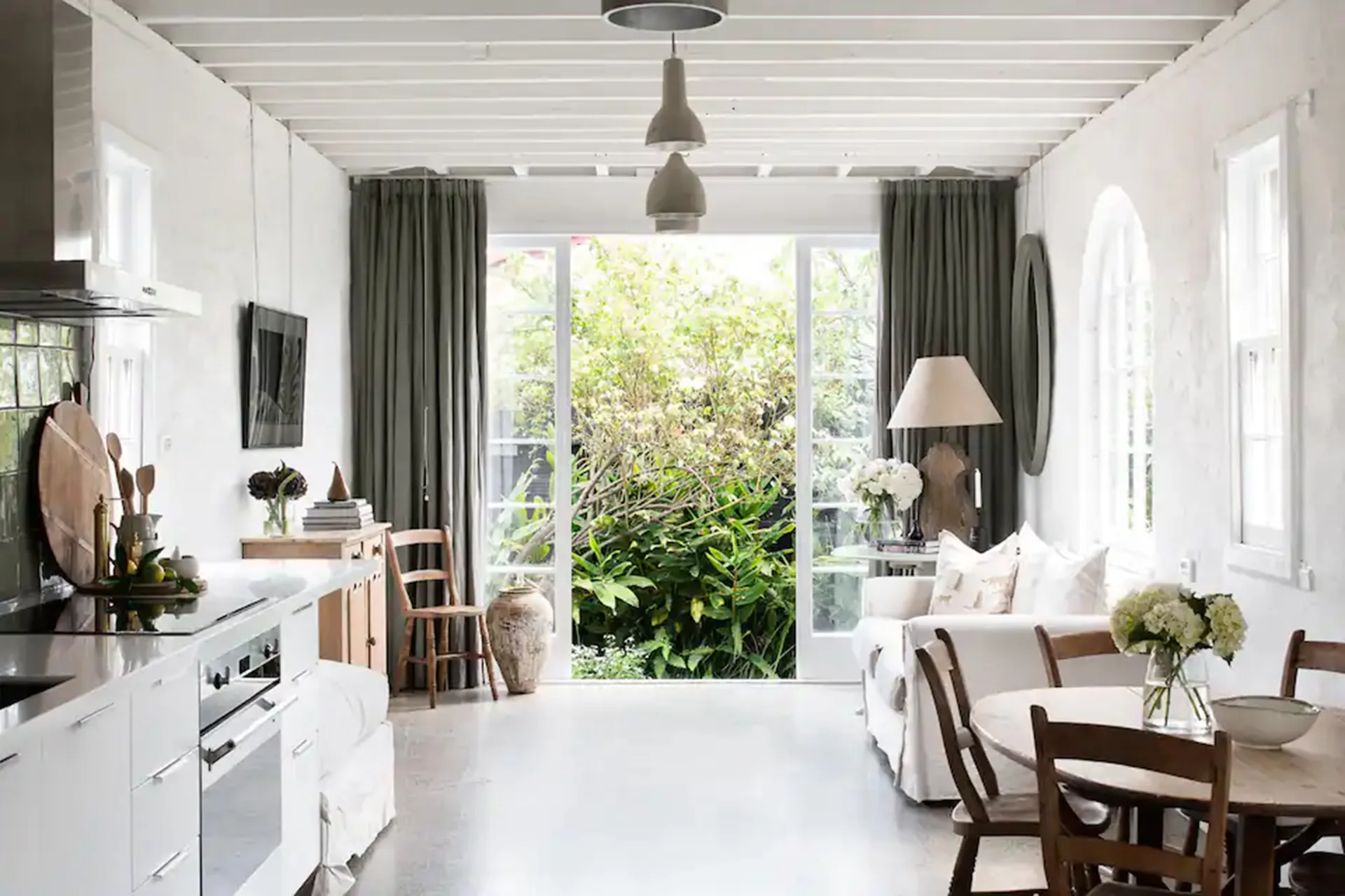 open-rustic-kitchen-living-dining-area-with-ceiling-beams