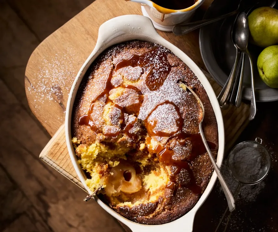 A pear sponge pudding drizzled with salted caramel sauce