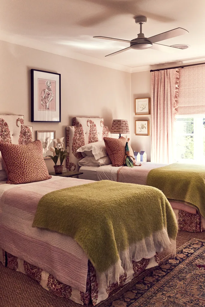 Two single beds in a pink-toned bedroom