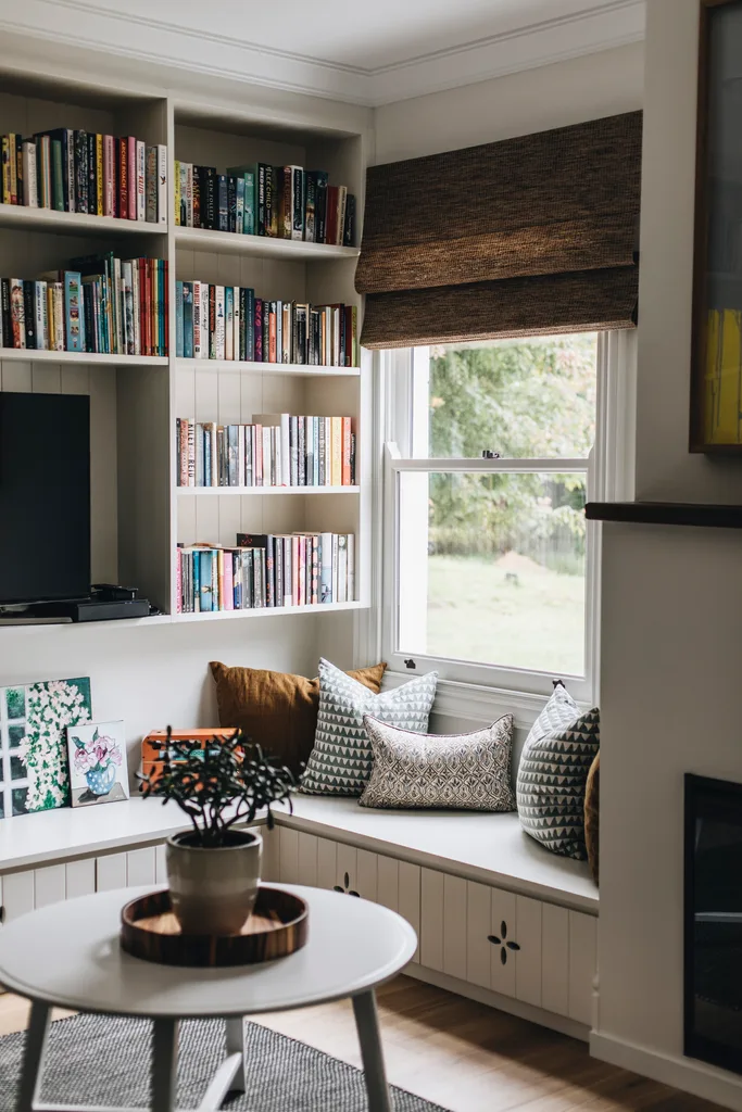 A cosy seating nook framed by bookshelves