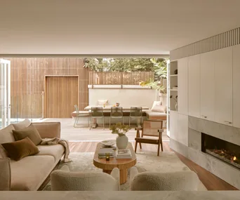 A contemporary, neutral-toned living room in a renovated Federation cottage