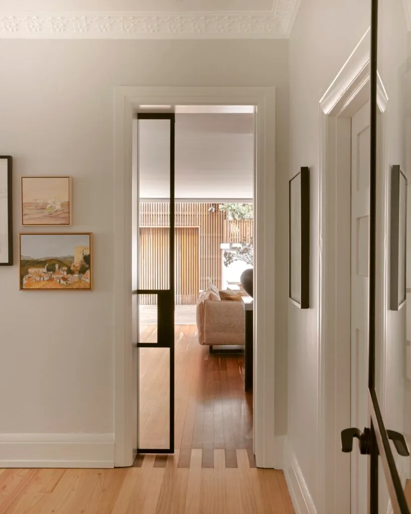 A hallway leading to a contemporary living area