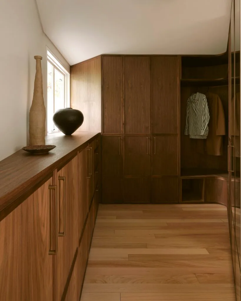 Timber cabinetry in a walk-in wardrobe