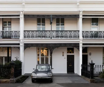 The stately facade of a London-style Victorian terrace home in Melbourne